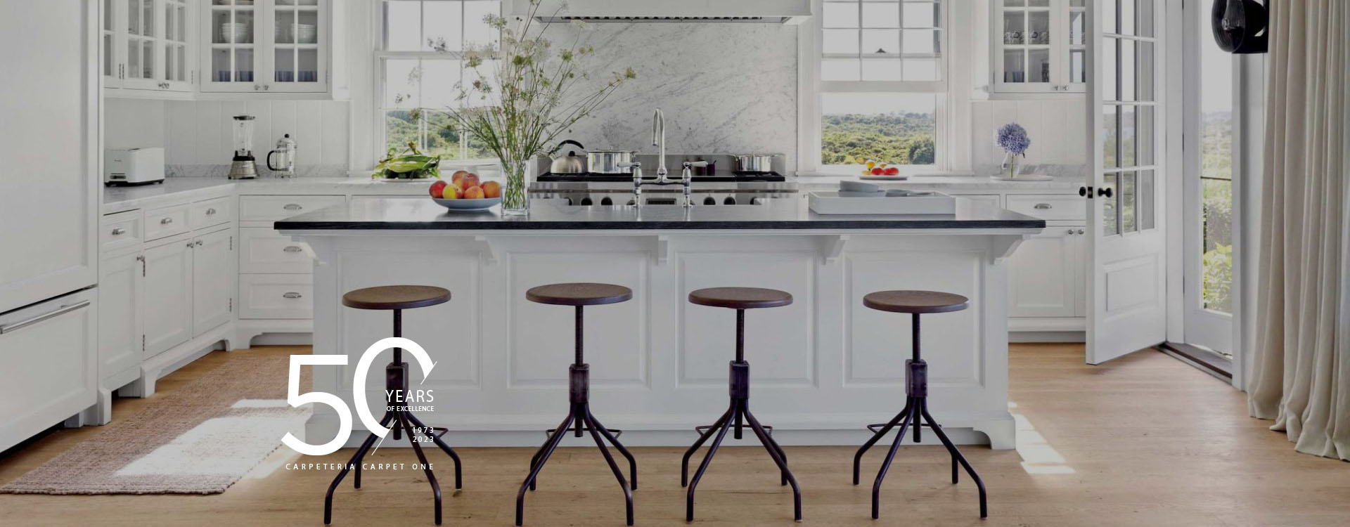 kitchen with wood-look floors and 50 years of excellence logo